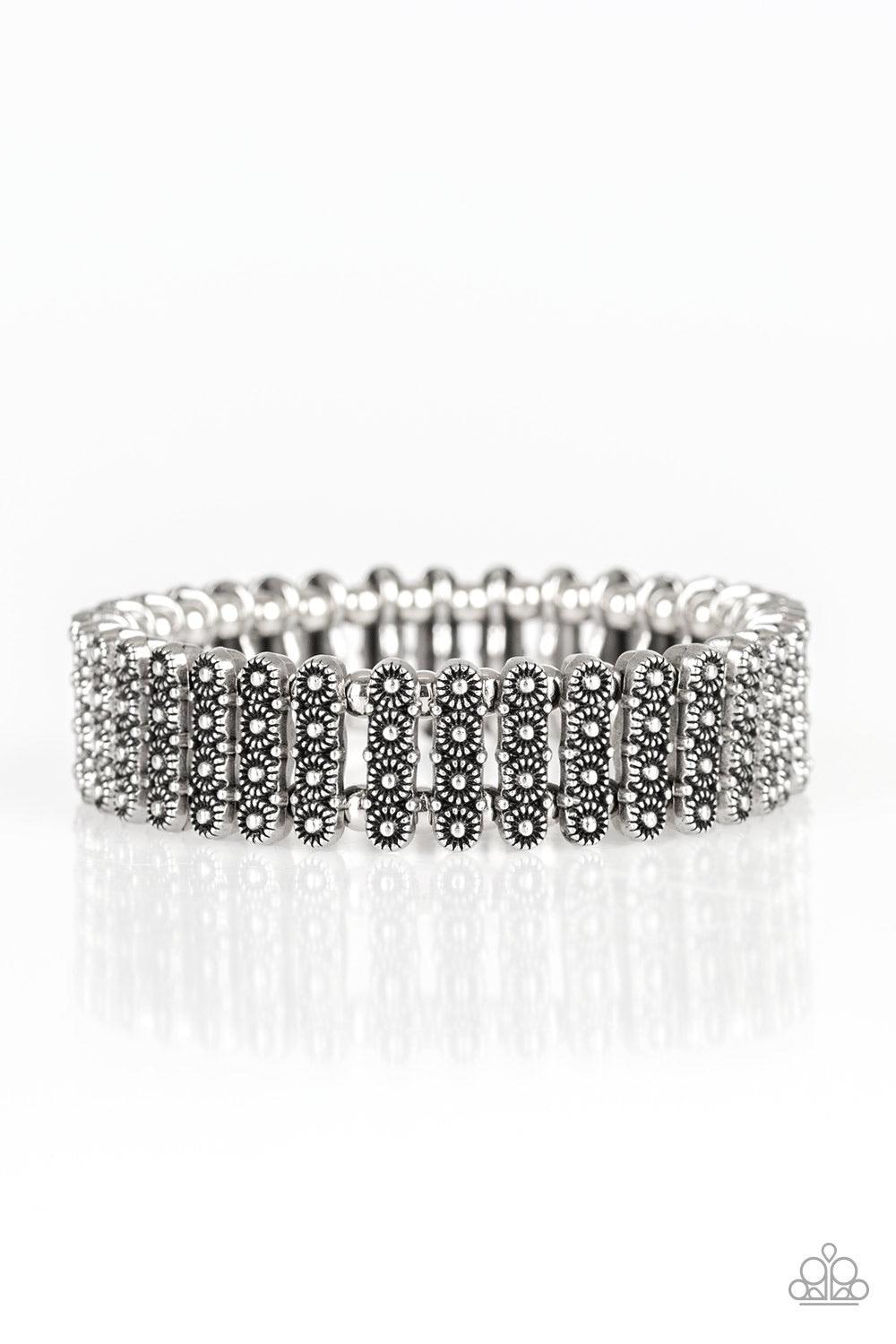 Paparazzi Accessories Rise With The Sun - Silver Dainty silver beads and stacked silver frames radiating with sunburst patterns are threaded along stretchy bands around the wrist for a whimsical look. Jewelry