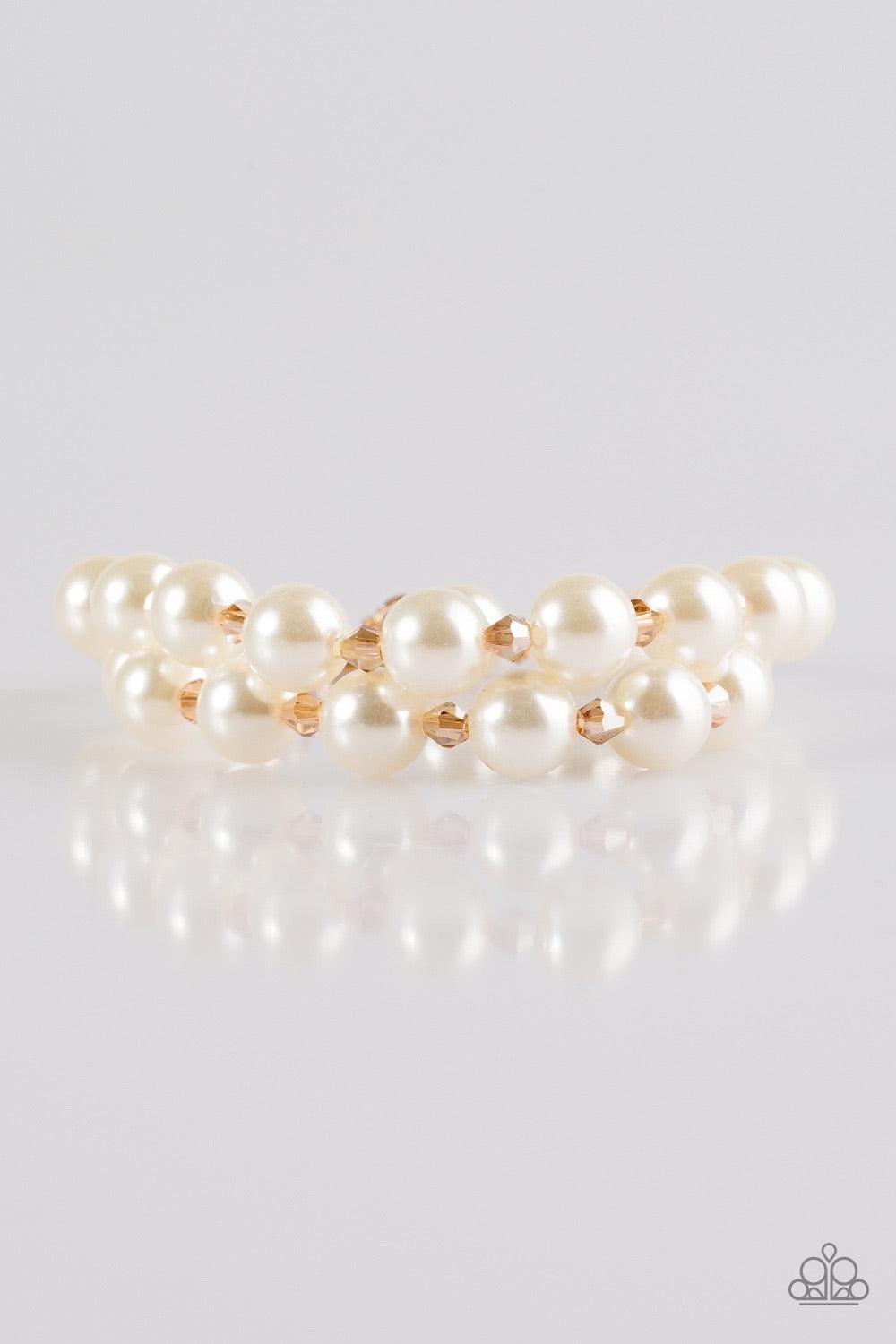 Paparazzi Accessories BALLROOM And Board - Gold Rows of dainty gold crystal-like beads and classic white pearls are strung across the wrist for a timeless look. Features an adjustable clasp closure. Jewelry