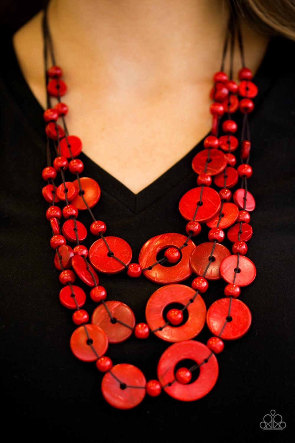 Paparazzi Accessories Bali Boardwalk - Red Brushed in a distressed finish, vivacious red wooden beads and discs trickle along three strands, creating a summery look down the chest. Features a button loop closure. Jewelry