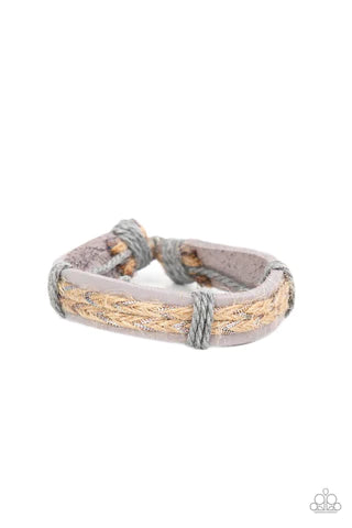 Paparazzi Accessories Guided Expedition Glimmering metallic thread is braided with natural twine and laced to the top of a lavender leather band creating a rustic homespun style around the wrist. Features an adjustable sliding knot closure. Sold as one in