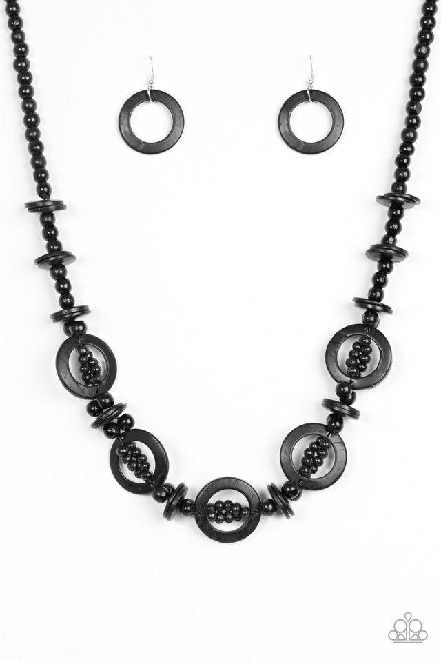 Paparazzi Accessories Fiji Foxtrot - Black Mismatched black wooden beads are threaded along a black cord for an earthy look. Black wooden discs connect with beaded links across the chest for a summery finish. Jewelry