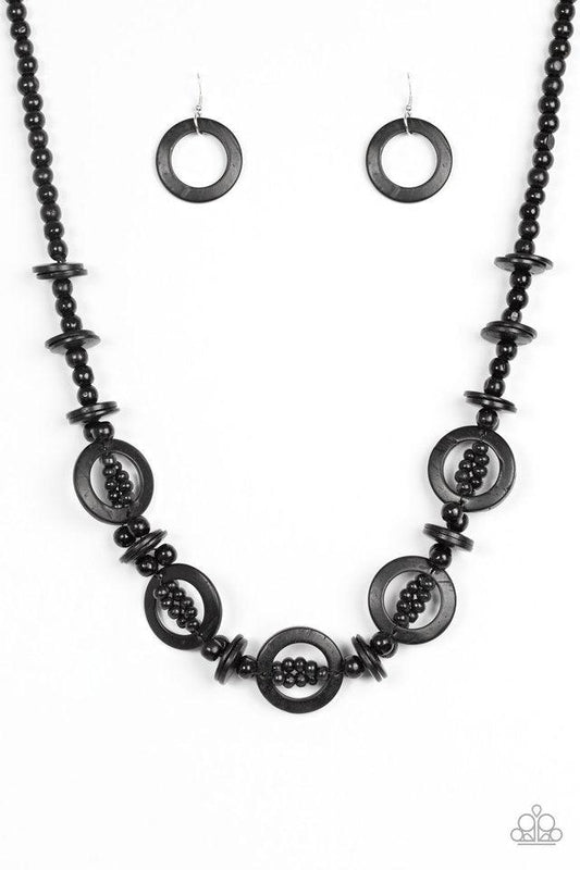 Paparazzi Accessories Fiji Foxtrot - Black Mismatched black wooden beads are threaded along a black cord for an earthy look. Black wooden discs connect with beaded links across the chest for a summery finish. Jewelry