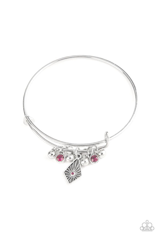 Paparazzi Accessories Treasure Charms - Pink A collection of shimmery silver beads and glittery pink rhinestone accents slide along a sleek bar fitting, creating whimsical charms as they glide along the dainty silver bangle. Sold as one individual bracele