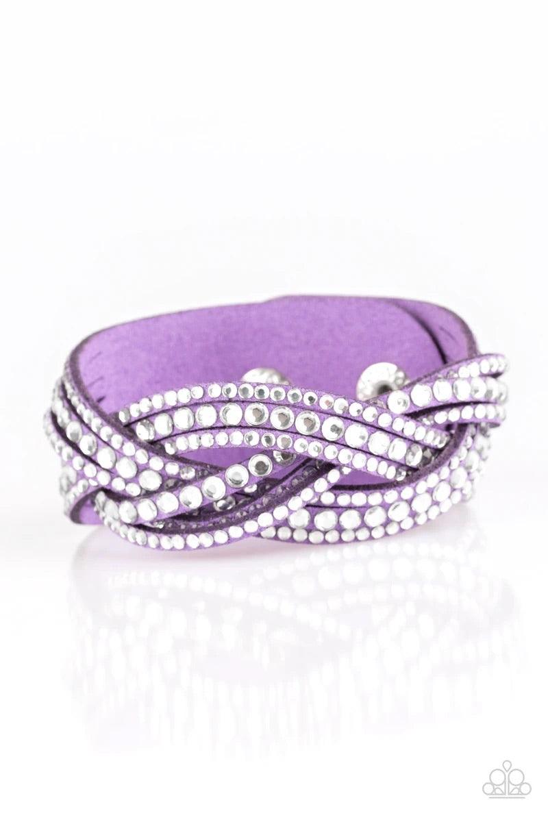 Paparazzi Accessories Bring on the Bling - Purple Bring On The Bling -Purple Urban Bracelet -Varying in size, glassy white rhinestones are encrusted along interwoven purple suede bands, creating blinding shimmer across the wrist. Features an adjustable sn
