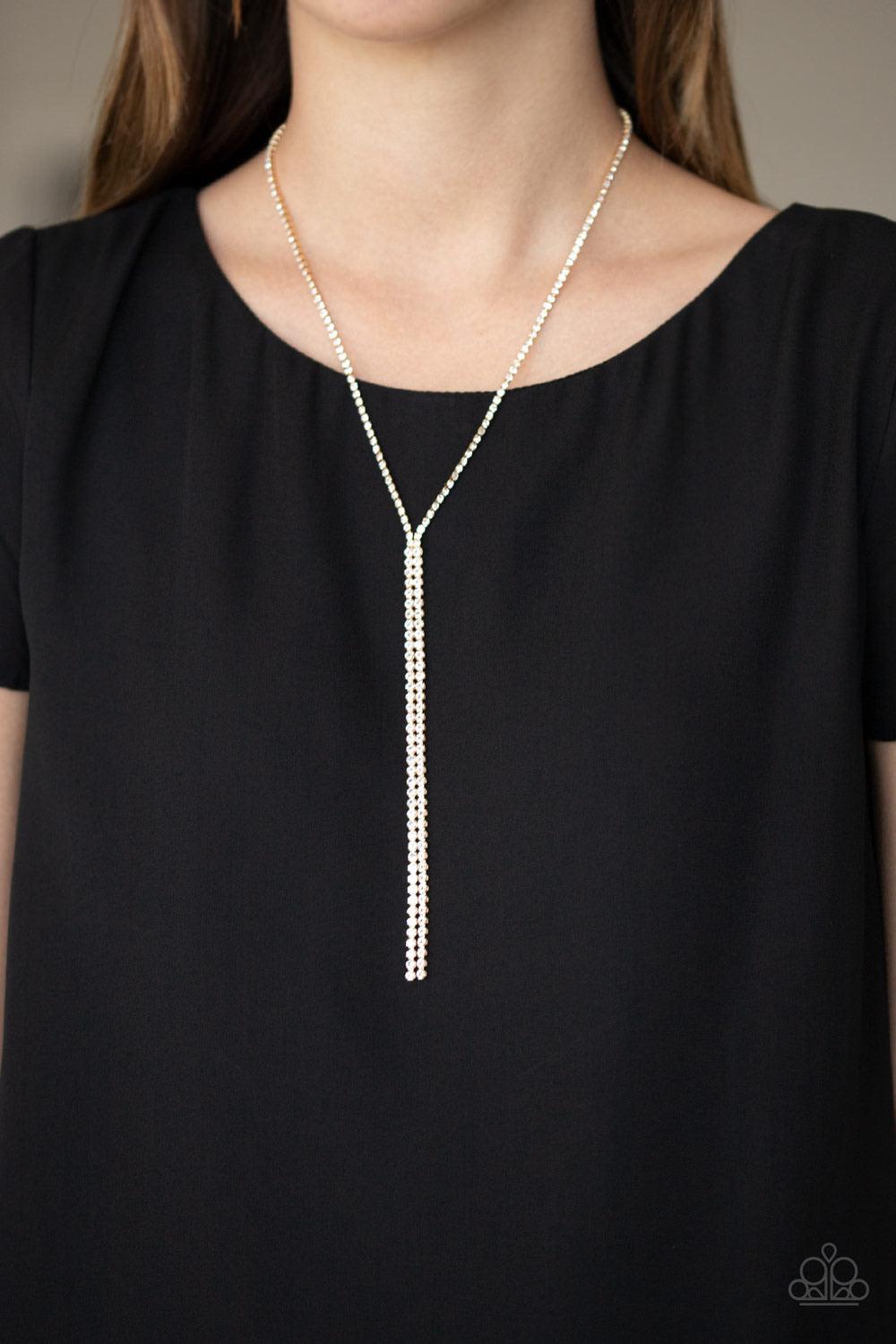 Paparazzi Accessories Inner STARLIGHT - Gold Featuring square gold fittings, a dainty strand of glassy white rhinestones drapes around the neck. The glittery strands delicately connect, splitting off into two twinkling tassels down the chest. Features an