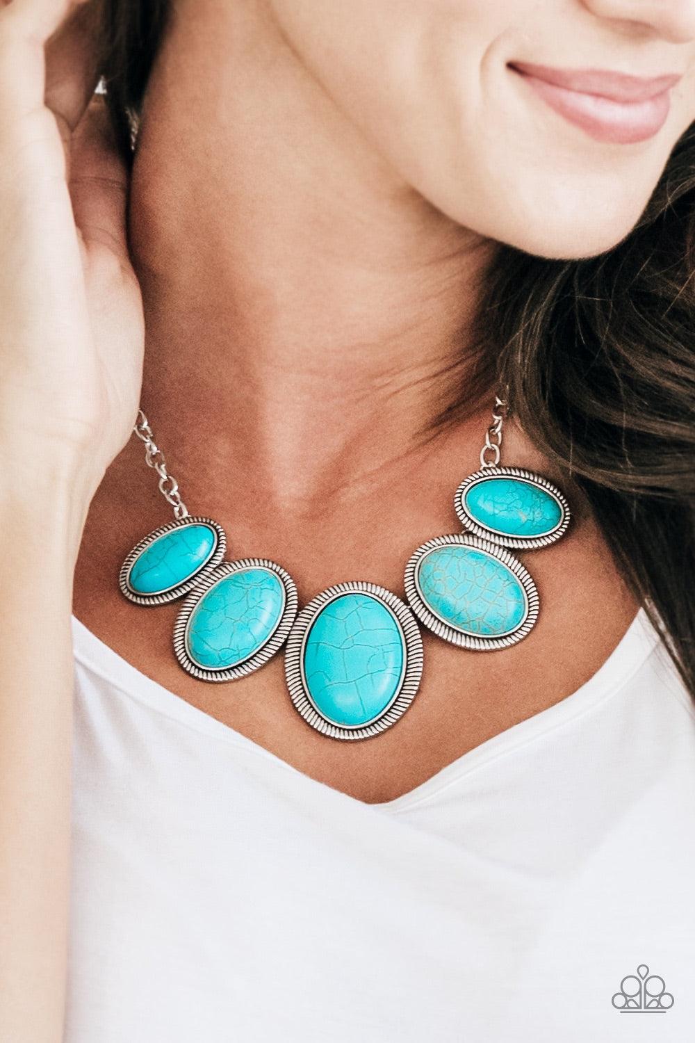 Paparazzi Accessories Noble Nomand - Blue Gradually increasing in size towards the center, refreshing turquoise stones are pressed into serrated silver frames, linking below the collar for a bold artisan look. Features an adjustable clasp closure. Jewelry