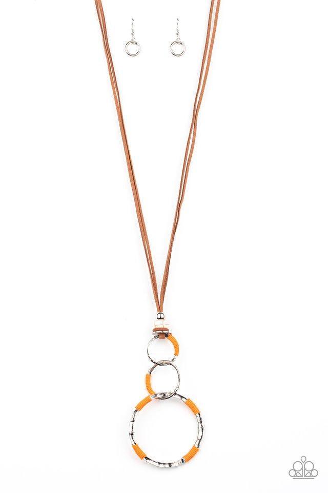 Paparazzi Accessories Rural Renovation - Orange Wrapped in sections of orange threaded accents, a mismatched trio of hammered silver rings link at the bottom of a beaded fitting. The earthy compilation is attached to lengthened strands of brown suede for