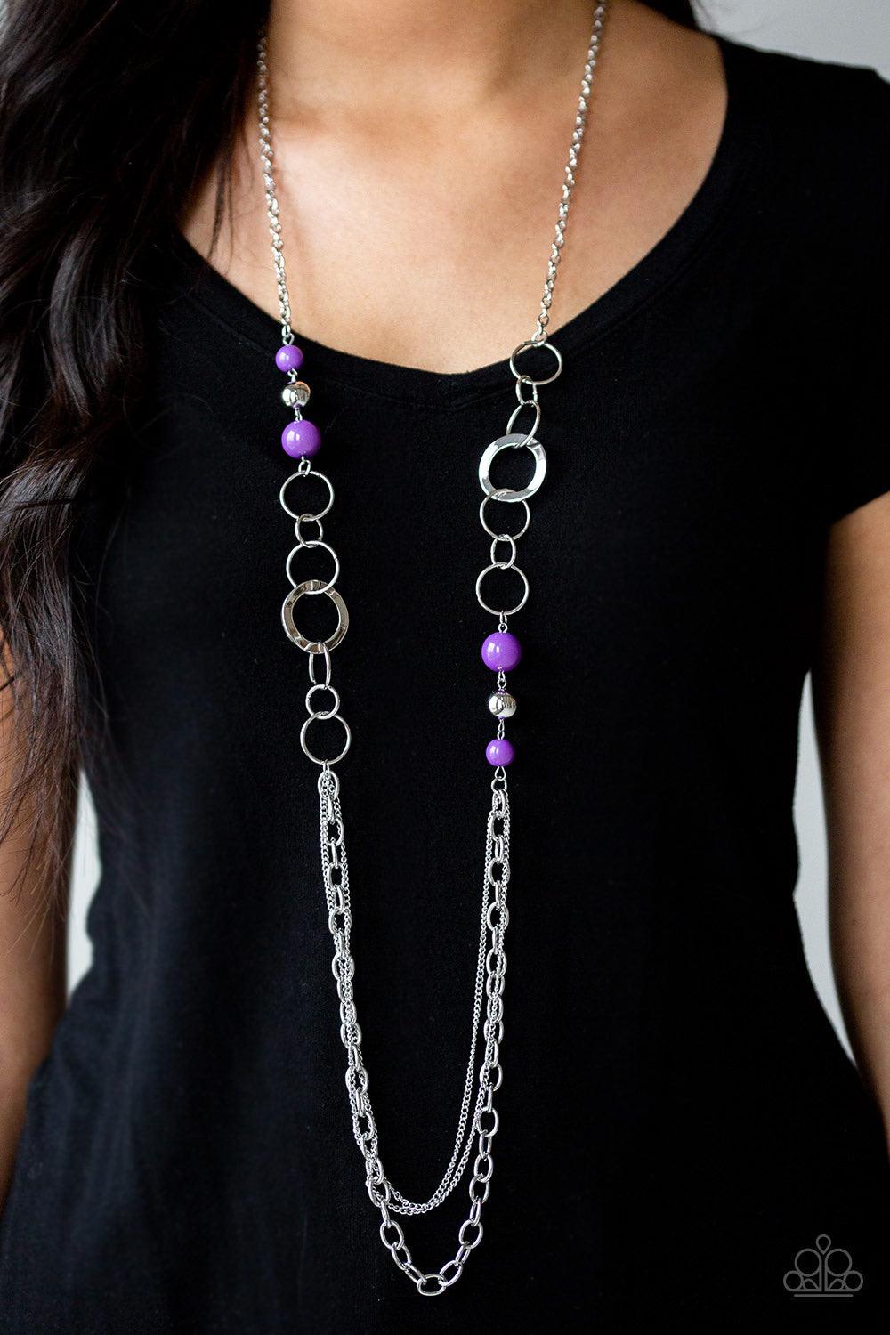 Paparazzi Accessories Modern Motley - Purple Vivacious purple beads, shiny silver beads, and glistening silver hoops give way to layers of mismatched silver chains for a whimsical look. Features an adjustable clasp closure. Sold as one individual necklace