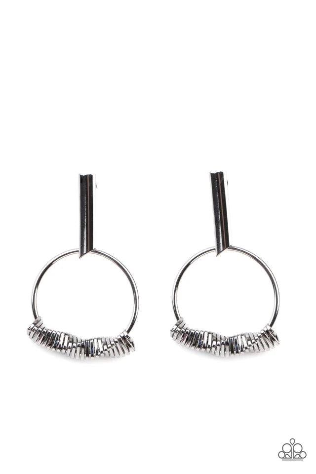 Paparazzi Accessories Set Into Motion - Black Glistening gunmetal triangular rings are delicately fitted in place along the bottom of a dainty gunmetal hoop, creating the illusion of twisting movement. The edgy hoop links to a gunmetal rectangular hoop, c