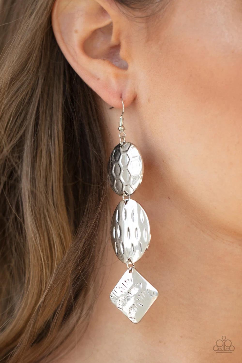 Paparazzi Accessories Mixed Movement - Silver Featuring a variety of earthy textures, three mismatched silver frames delicately link into a free-spirited stacked lure. Earring attaches to a standard fishhook fitting. Sold as one pair of earrings. Jewelry