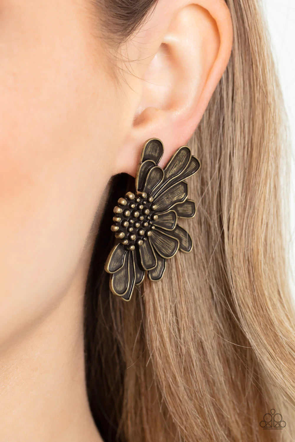 Paparazzi Accessories Farmstead Meadow - Brass Imperfect brass petals bloom from a studded center, layering into a rustic half blossom for a whimsical flair. Earring attaches to a standard post fitting. Sold as one pair of post earrings.