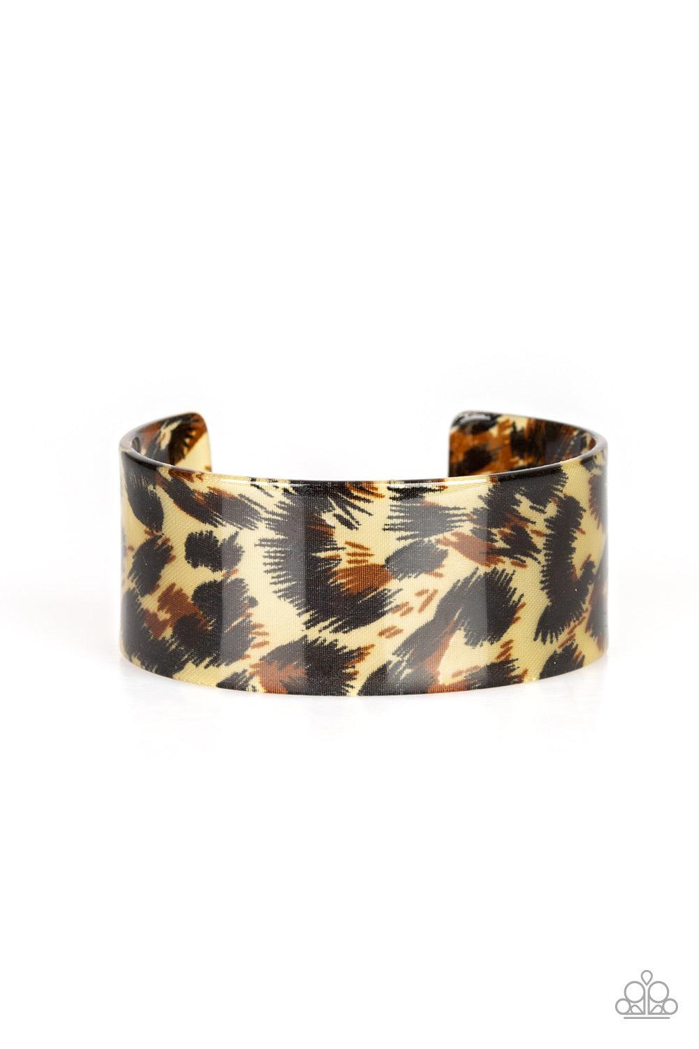 Paparazzi Accessories Where’s The Party? - Brown Featuring cheetah-like print, a thick acrylic cuff wraps around the wrist for a retro inspired look. Jewelry