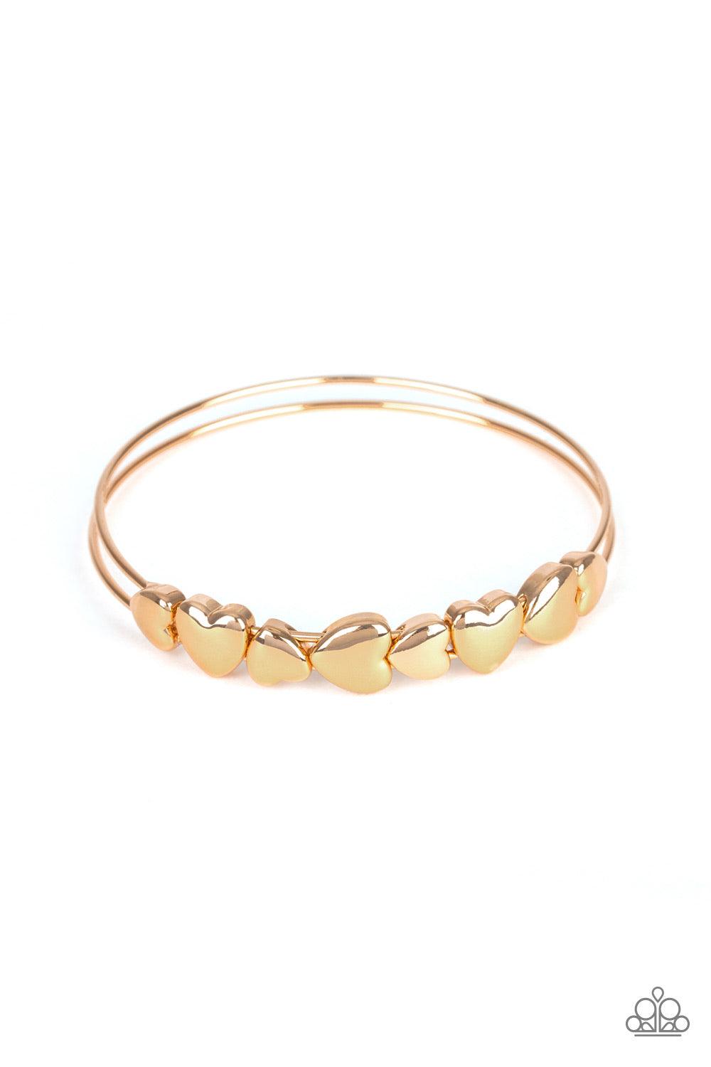 Paparazzi Accessories Totally Tenderhearted - Gold A charming collection of gold heart frames coalesce around a doubled gold bangle, creating a whimsical centerpiece. Jewelry