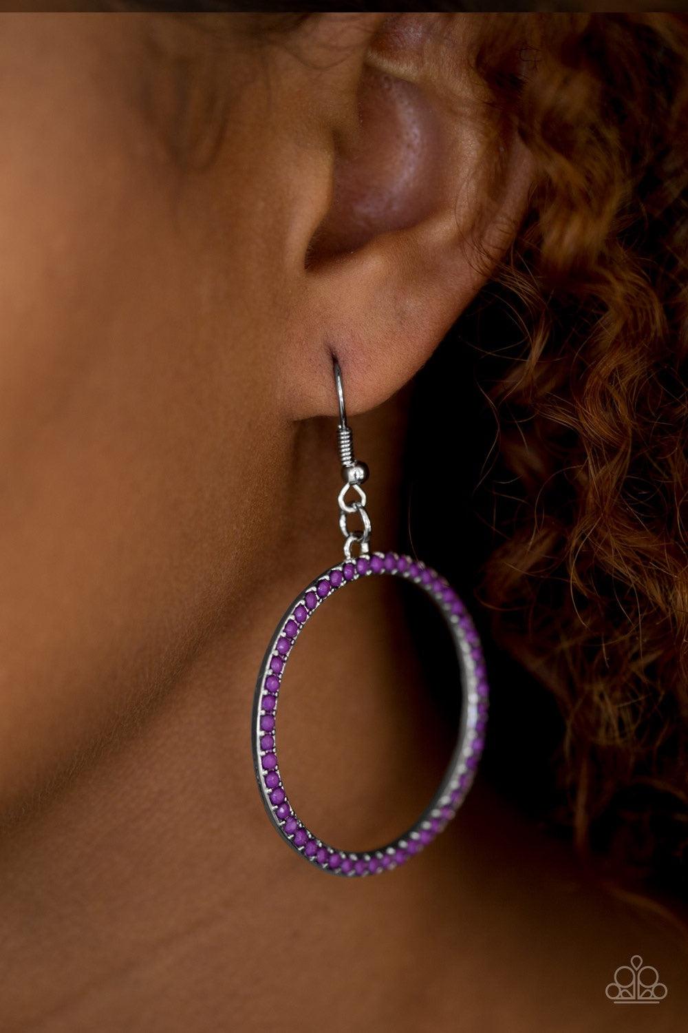 Paparazzi Accessories Spring Party - Purple Dainty purple beads are encrusted along a shimmery silver hoop for a perfect pop of seasonal color. Earring attaches to a standard fishhook fitting. Jewelry