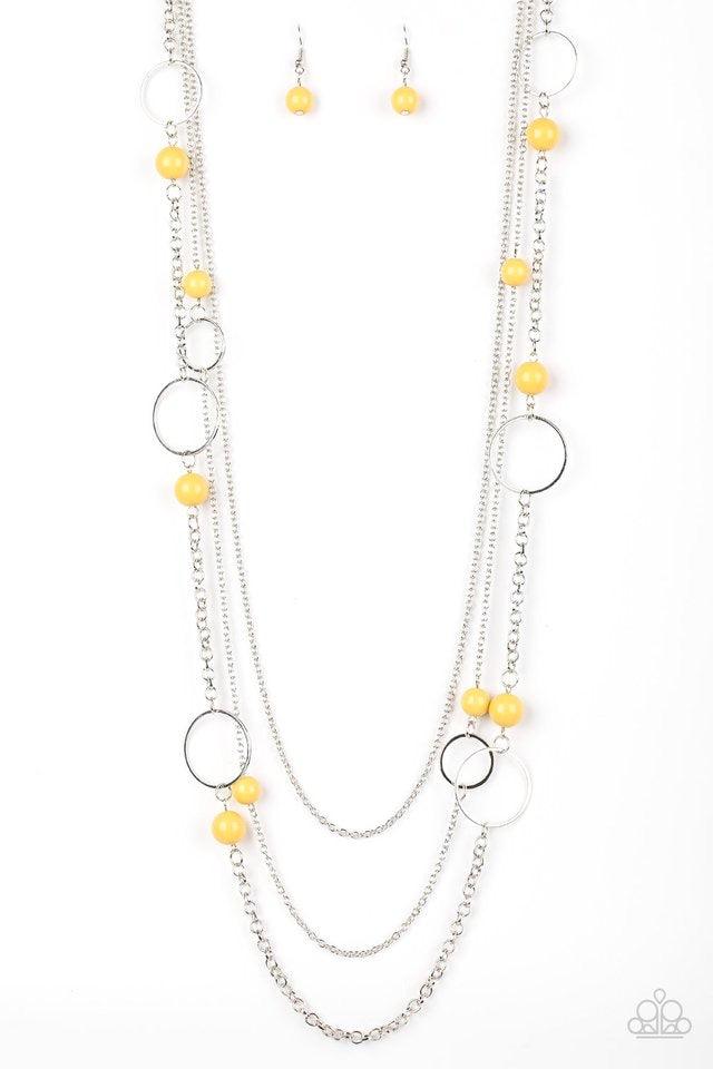 Paparazzi Accessories Beachside Babe - Yellow Featuring hearty yellow beads and shimmery silver hoops, mismatched silver chains layer down the chest for a seasonal look. Features an adjustable clasp closure. Jewelry