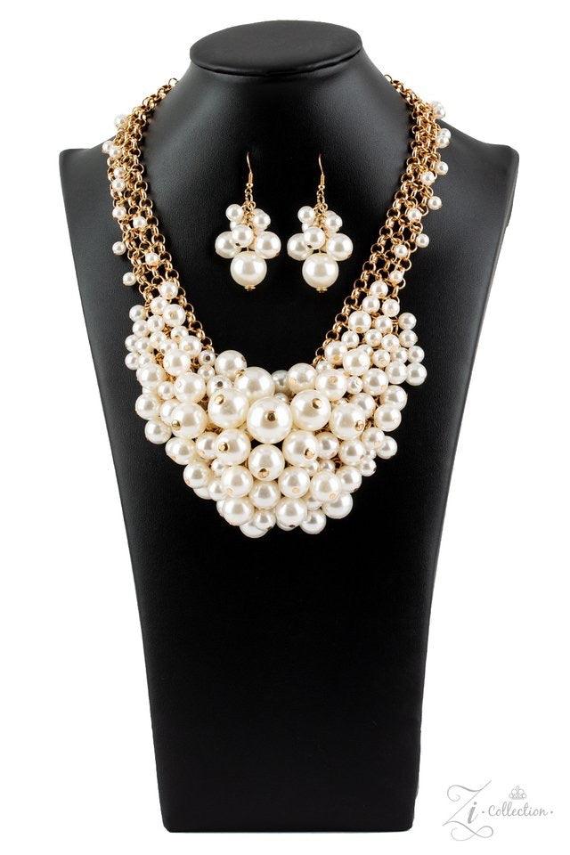 Paparazzi Accessories Exec-YOU-tive Clusters of elegant white pearls swing from a tapered net of interlocking gold chains, creating an effervescent statement piece. The bubbly fringe sits just below the collar, giving off a playfully professional vibe. Fe