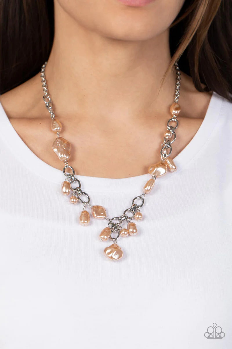 Paparazzi Accessories Nautical Nouveau - Brown A modern collection of asymmetrical pearly brown beads adorn sections of a chunky silver chain below the collar. Matching pearly beads sporadically trickle from the chain, resulting in a timelessly tasseled d