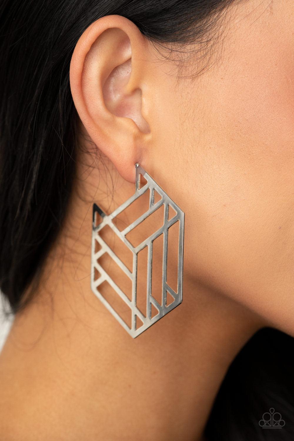 Paparazzi Accessories Gotta Get GEO-ing - Silver Flat silver bars connect into an edgy hexagonal frame, creating a chic geometric hoop. Earring attaches to a standard post fitting. Hoop measures approximately 2 3/4" in diameter. Sold as one pair of hoop e