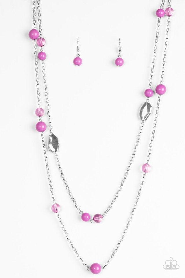 Paparazzi Accessories Hitting a Glow Point - Purple Featuring faceted silver accents, glassy and polished purple beads trickle along strands of shimmery silver chains for a seasonal look. Features an adjustable clasp closure. Jewelry