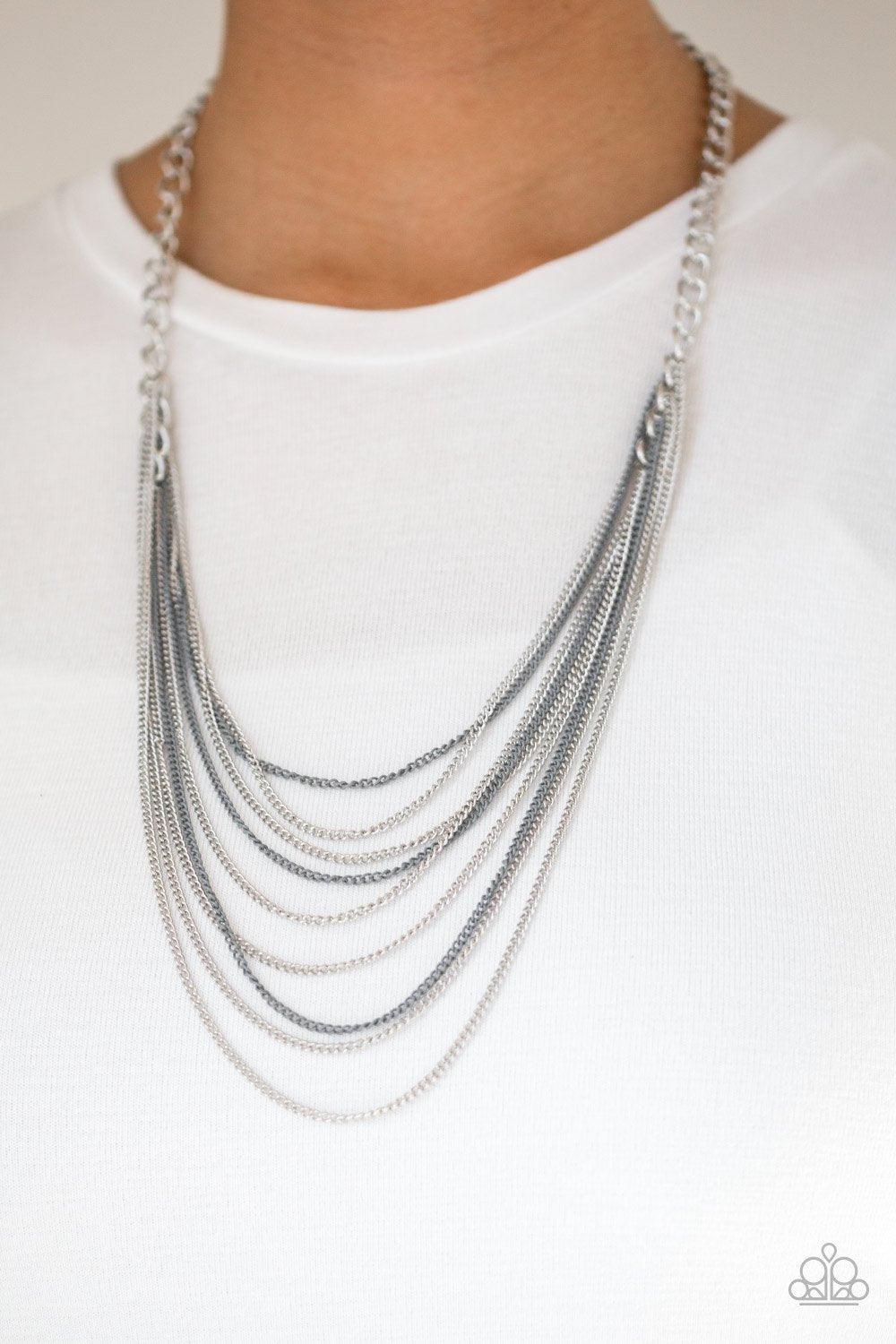 Paparazzi Accessories Rebel Rainbow - Silver Strands of bold silver links give way to rows of shimmery silver and shiny gray chains, creating colorful layers down the chest. Features an adjustable clasp closure. Sold as one individual necklace. Includes o