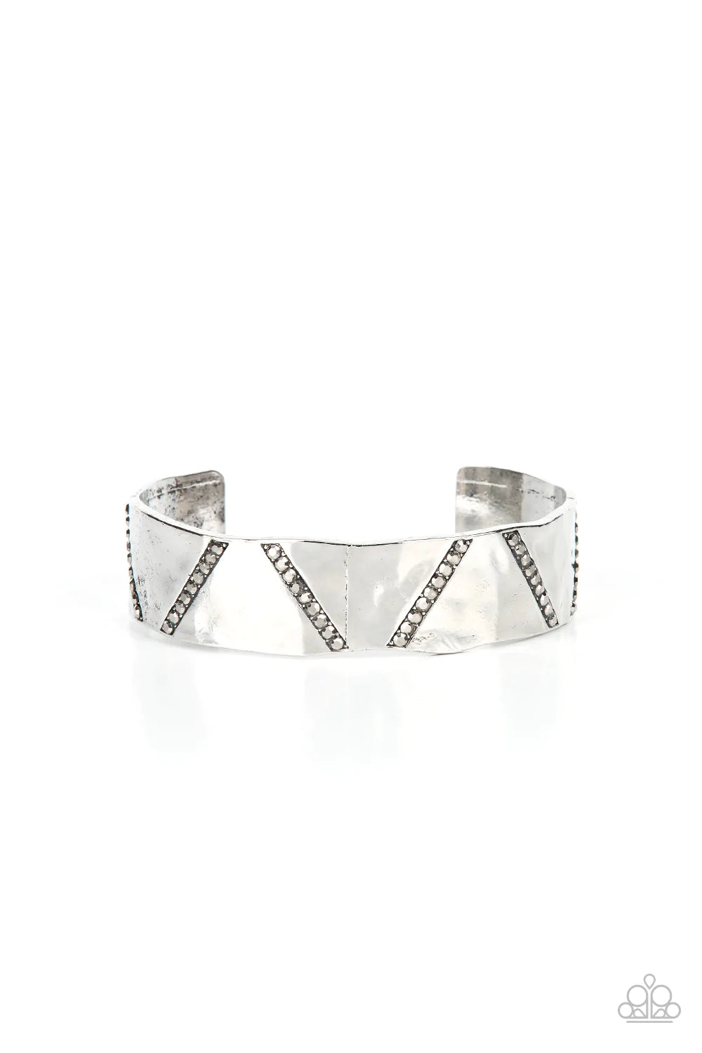 Paparazzi Accessories Couture Crusher - Silver Rows of smoky hematite rhinestones slant across the front of a gently hammered silver cuff that waves around the wrist, result in an edgy shimmer. Sold as one individual bracelet. Jewelry