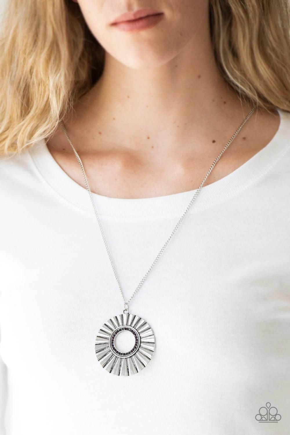 Paparazzi Accessories Chicly Centered - Purple Brushed in a gritty antiqued finish, a rippling silver frame flares from a purple rhinestone encrusted center for an edgy look. Features an adjustable clasp closure. Jewelry