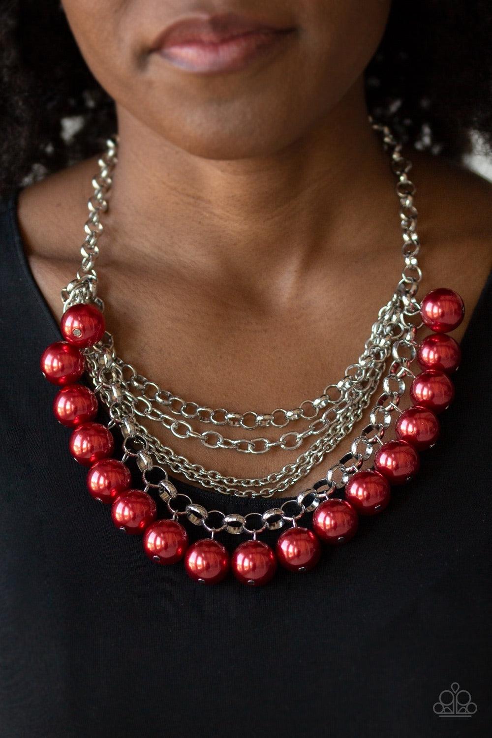 Paparazzi Accessories One-Way WALL Street - Red A collision of mismatched silver chains layer below the collar. Oversized red pearls dangle from the lowermost chain, creating a dramatically refined fringe for a statement-making finish. Features an adjusta