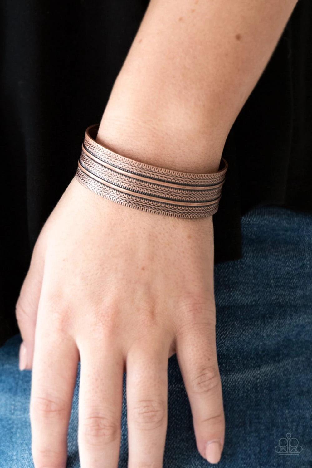 Paparazzi Accessories Absolute Amazon - Copper Stamped in tribal-inspired patterns, an antiqued copper cuff wraps around the wrist for an indigenous look. Sold as one individual bracelet. Jewelry