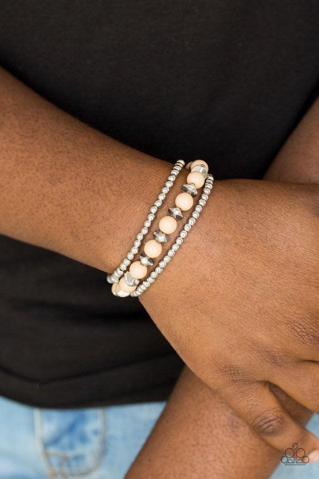 Paparazzi Accessories Epic Escape - Brown Polished brown beads and mismatched silver beads are threaded along stretchy bands for a seasonal look. Jewelry