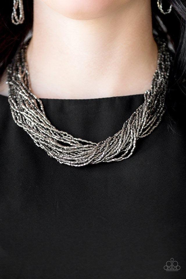 Paparazzi Accessories The Speed of STARLIGHT ~Gunmetal Strands of glistening gunmetal seed beads subtlety twist below the collar, coalescing into a blinding shimmer. Features an adjustable clasp closure.