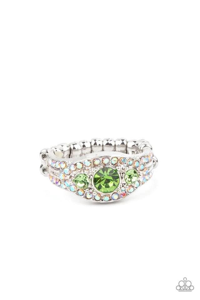 Paparazzi Accessories Celestial Crowns - Green A trio of brilliant green rhinestones is set inside a glittering rhinestone-encrusted frame creating a divinely heavenly essence atop the finger. Features a dainty stretchy band for a flexible fit. Sold as on