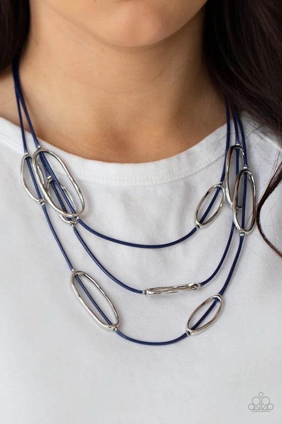Paparazzi Accessories Check Your CORD-inates - Blue An asymmetrical collection of hammered silver ovals are fitted in place along three rows of shiny blue cords, creating an edgy display below the collar. Features an adjustable clasp closure. Sold as one