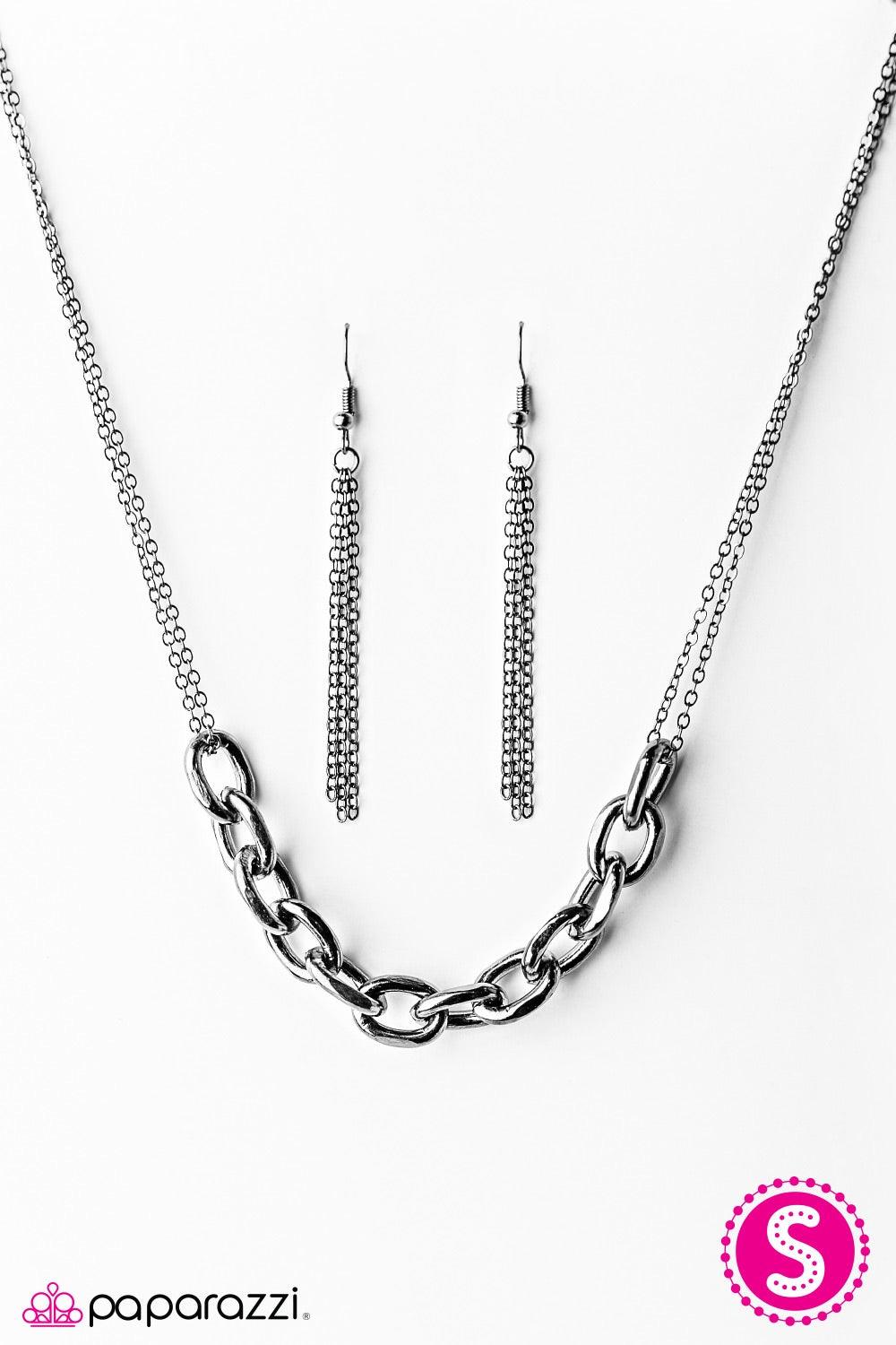 Paparazzi Accessories Lo And Be-BOLD - Black Strands of glistening gunmetal chain give way to a chunky section of gunmetal chain, creating bold metallic accents below the collar. Features an adjustable clasp closure. Jewelry