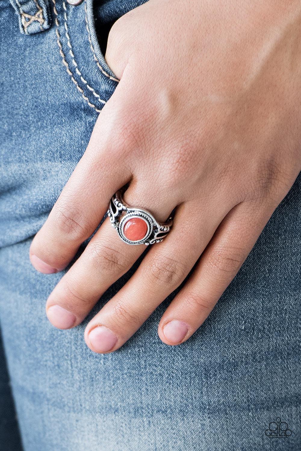 Paparazzi Accessories Peacefully Peaceful - Orange A tranquil Burnt Orange stone is pressed into the center of a studded silver band for a seasonal look. Features a dainty stretchy band for a flexible fit. Sold as one individual ring. Jewelry