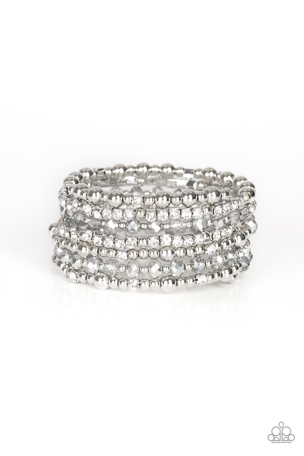 Paparazzi Accessories ICE Knowing You - White An icy collection of silver beads, silver cubes, white crystals, and glassy white rhinestones are threaded along a coiled wire, creating a blinding infinity wrap style bracelet around the wrist. Jewelry