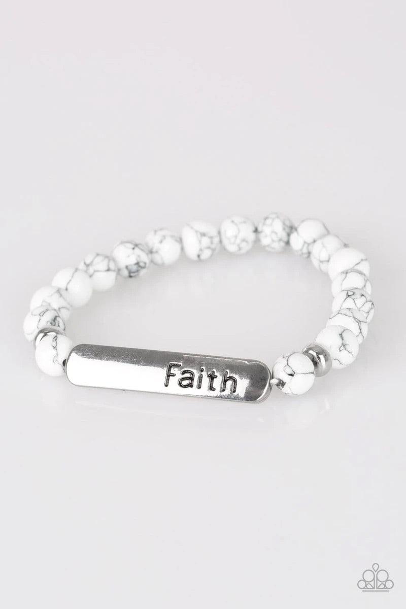 Paparazzi Accessories Fearless Faith - White Infused with dainty silver beads, refreshing white stone beads and a glistening silver plate stamped with the inspirational word, "Faith", are threaded along a stretchy band for a seasonal look. Sold as one ind