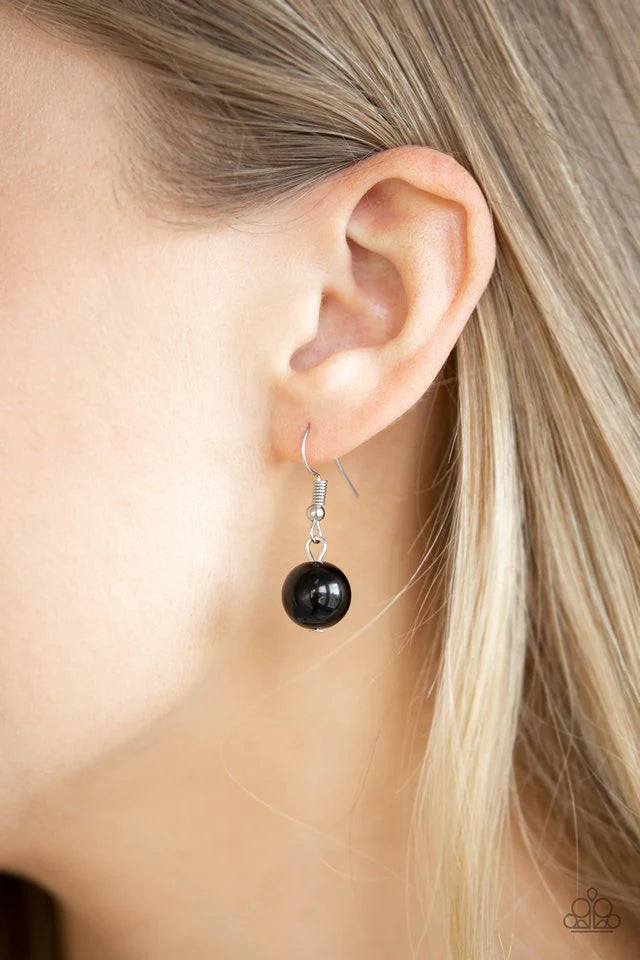 Paparazzi Accessories Pleasante Promenade - Black Featuring polished and cloudy faux rock finishes, black beads link with bold silver hoops. The whimsical compilation gives way to layers of mismatched silver chains for a seasonal finish. Features an adjus