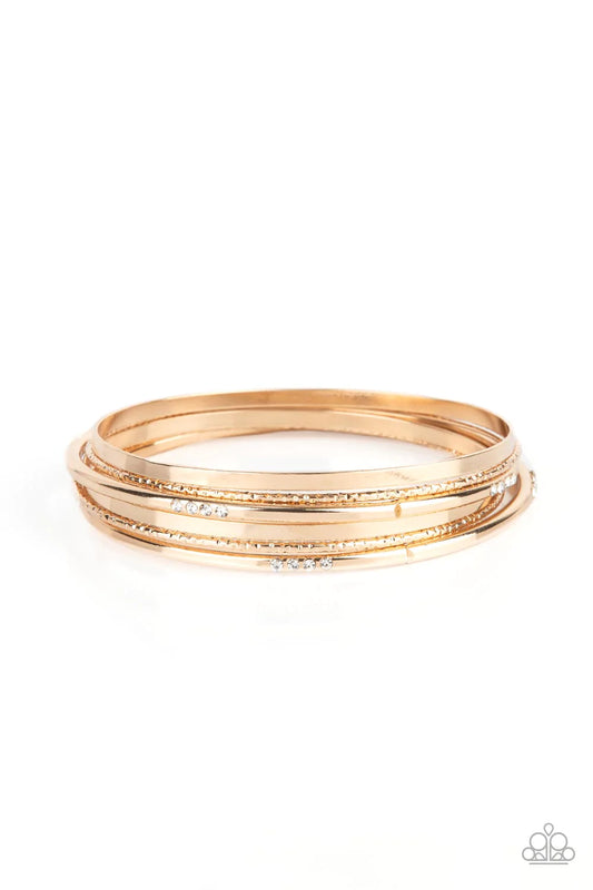 Paparazzi Accessories Lock, STACK, and Barrel - Gold Encrusted in sections of glittery white rhinestones, a mismatched collection of sparkly, smooth, and textured gold bangles stylishly stack up the wrist for a standout look. Sold as one bracelet. Jewelry