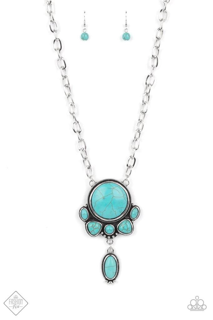 Paparazzi Accessories Geographically Gorgeous - Blue A large turquoise stone encased in a studded silver frame is swings dramatically from a heavy silver chain with oversized links. A collection of turquoise stones wraps around the bottom of the large pen