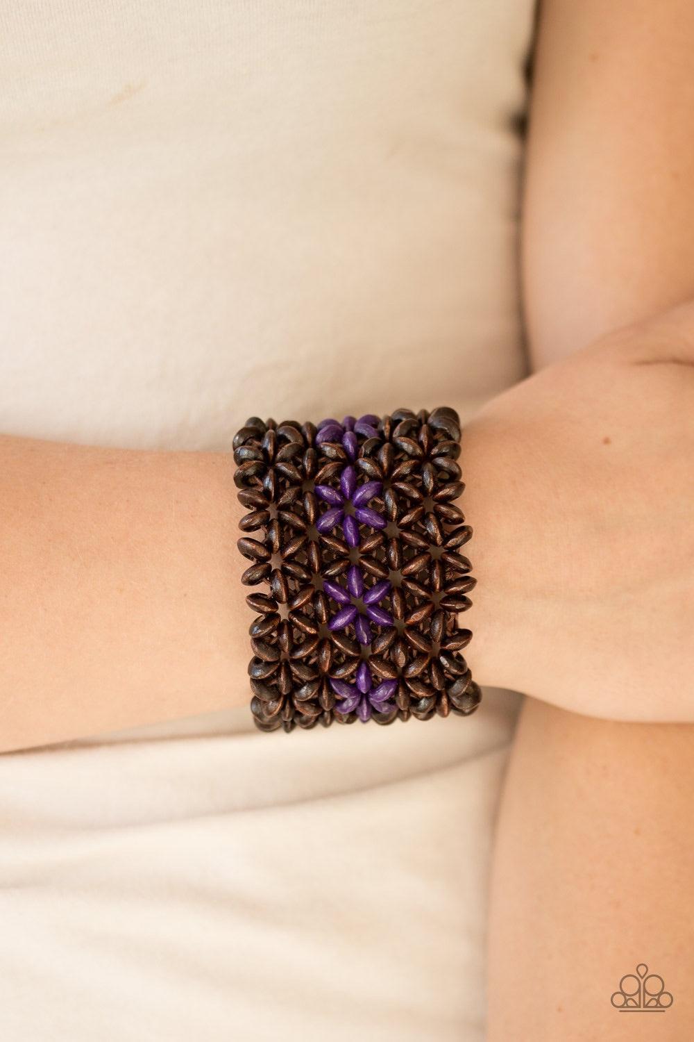 Paparazzi Accessories Bahama Babe - Purple Earthy wooden accents are threaded along elastic stretchy bands, creating an ornate bracelet. Tinted in a vivacious finish, purple wooden beads gather down the center, creating summery floral accents for a colorf
