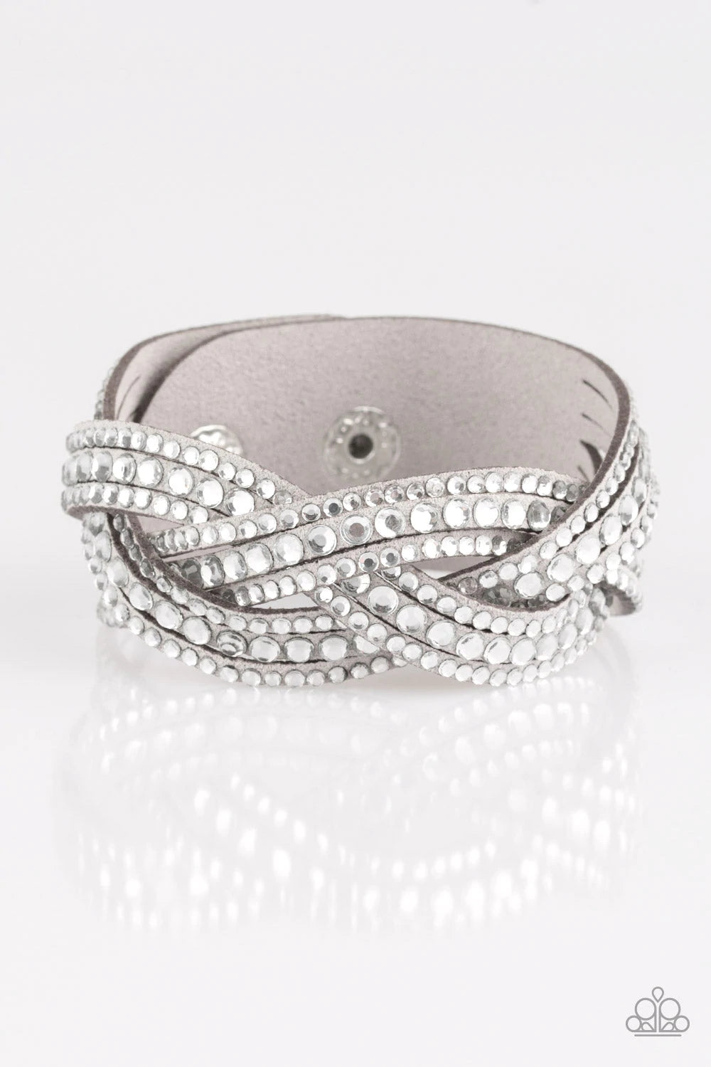 Paparazzi Accessories Bring on the Bling - Light Silver Varying in size, glassy white rhinestones are encrusted along interwoven gray suede bands, creating blinding shimmer across the wrist. Features an adjustable snap closure. Jewelry