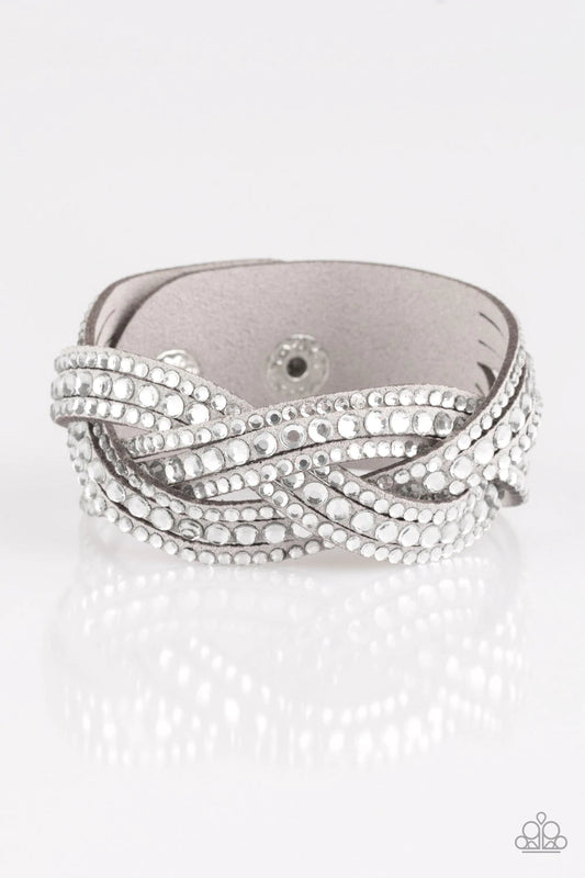Paparazzi Accessories Bring on the Bling - Light Silver Varying in size, glassy white rhinestones are encrusted along interwoven gray suede bands, creating blinding shimmer across the wrist. Features an adjustable snap closure. Jewelry