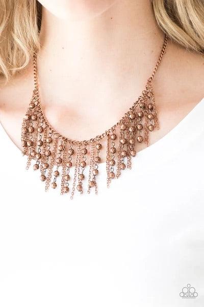 Paparazzi Accessories Rebel Remix - Copper Strands of faceted copper beads and glistening copper chains stream from a matching copper chain, creating an edgy fringe below the collar. Features an adjustable clasp closure. Sold as one individual necklace. I