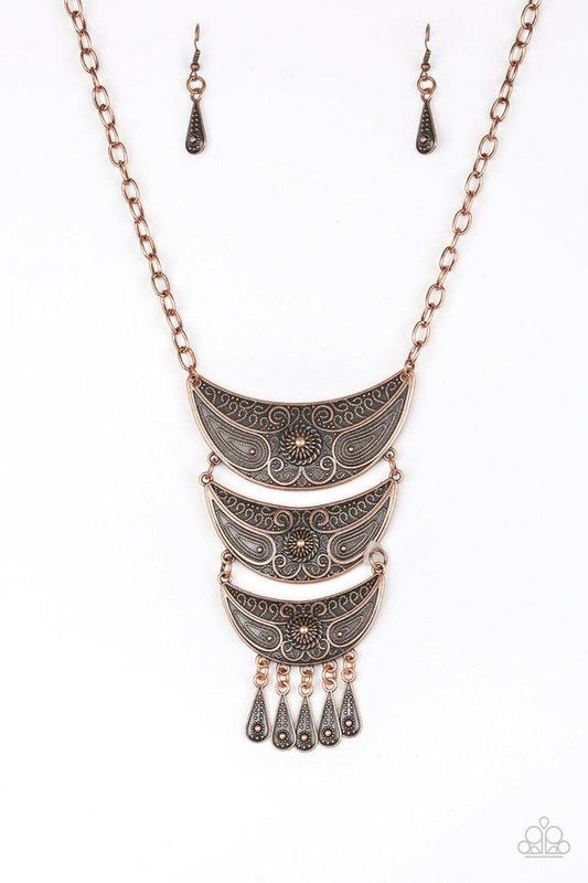 Paparazzi Accessories Go STEER -Crazy - Copper Gradually decreasing in size down the chest, decorative copper crescent plates connect into a bold pendant. Dotted in dainty studs, teardrop copper frames swing from the bottom of the tribal inspired pendant