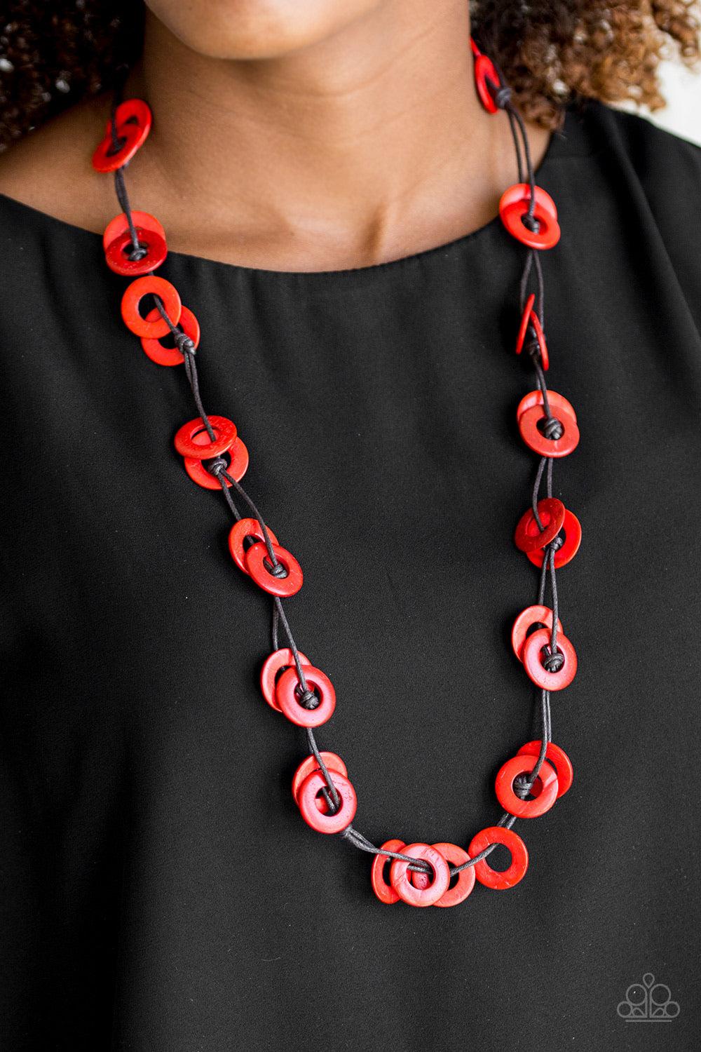 Paparazzi Accessories Waikiki Winds - Red Shiny brown cording knots around fiery red wooden discs, creating a colorful display across the chest. Features a button loop closure. Sold as one individual necklace. Includes one pair of matching earrings. Jewel