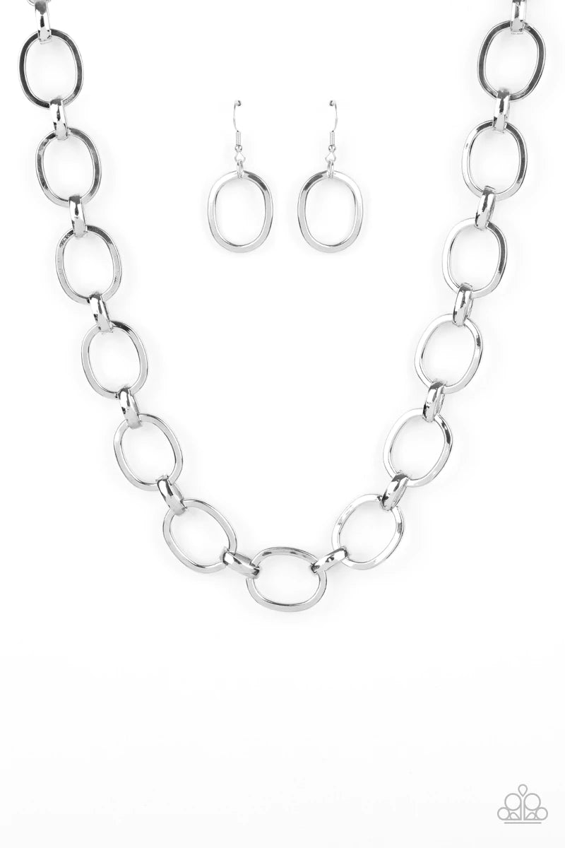 Paparazzi Accessories HAUTE-ly Contested - Silver A glistening series of dramatically oversized ovals and links boldly connect below the collar, creating an intense industrial statement. Features an adjustable clasp closure. Sold as one individual necklac