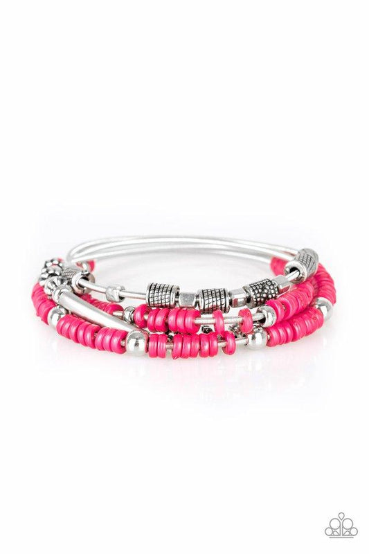 Paparazzi Accessories Tribal Spunk - Pink Mismatched silver accents and disc shaped pink beading slides along stretchy spring-like wires for a spunky tribal look. Sold as one set of four bracelets. Jewelry