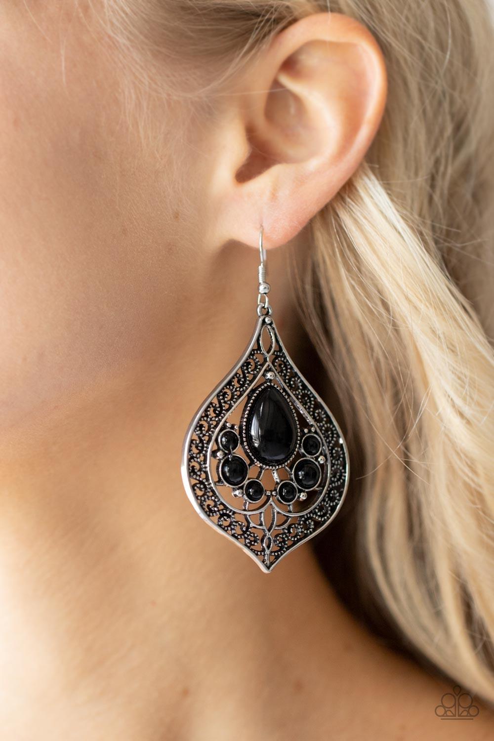 Paparazzi Accessories New Delhi Nouveau - Black Dotted in dainty white rhinestones, an asymmetrical oval gold frame swings from the ear for a sassy look. Earring attaches to a standard fishhook fitting. Sold as one pair of earrings. Jewelry