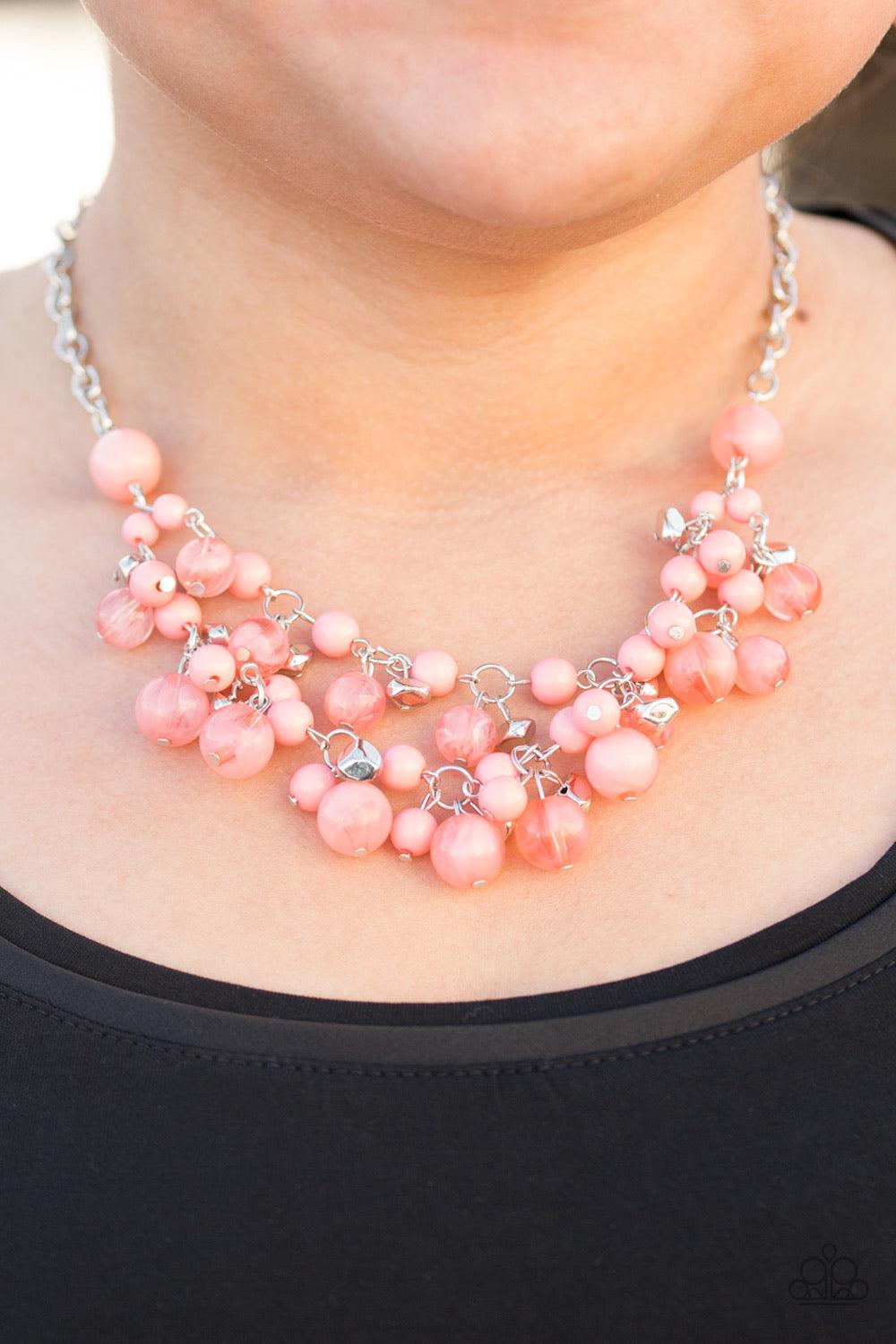 Paparazzi Accessories Spring Bride - Orange Polished and cloudy coral beads swing from two shimmery silver chains, creating a colorful fringe below the collar. Faceted silver beads trickle between the colorful accents, adding depth and shimmer to the whim