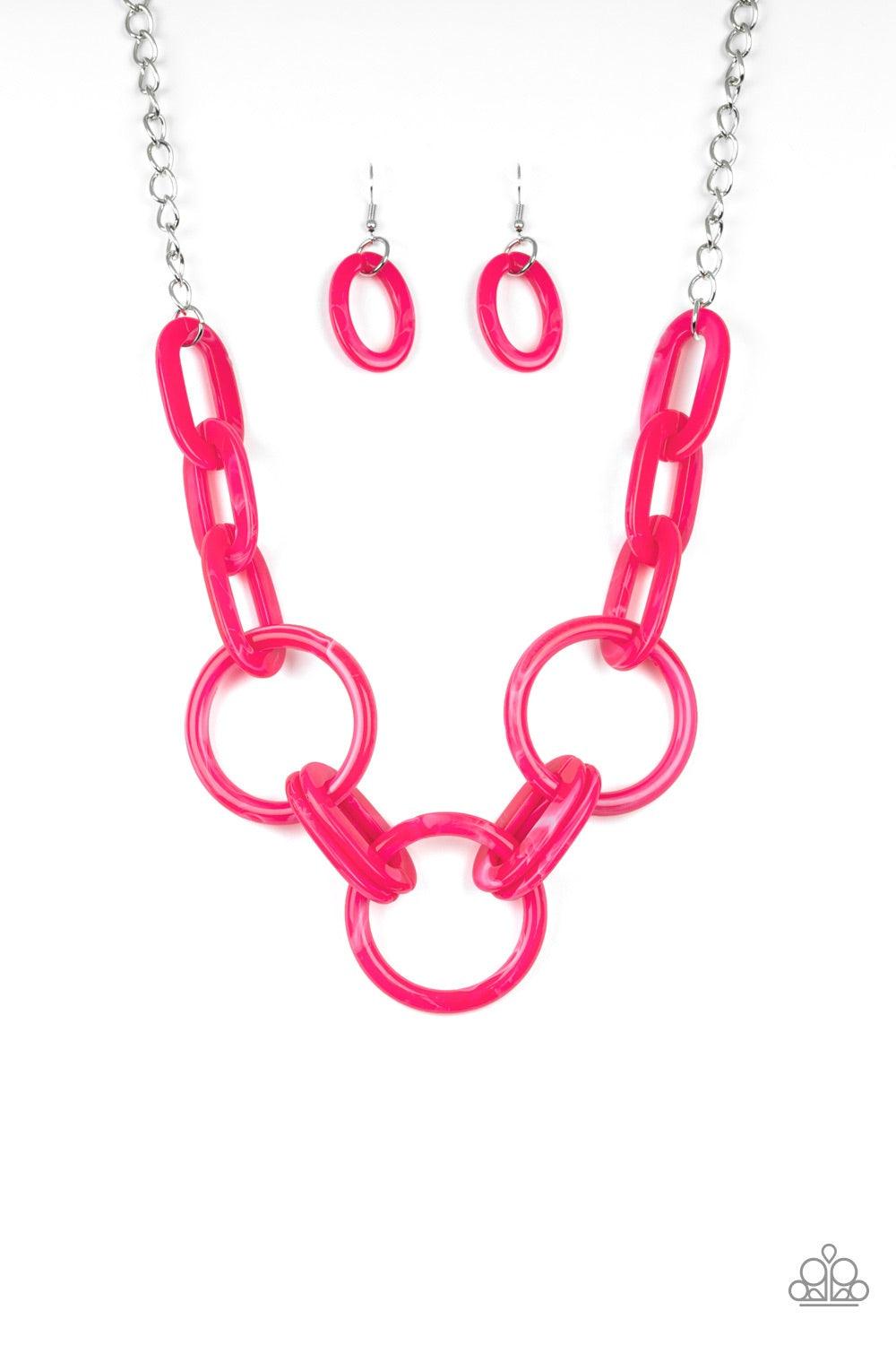 Paparazzi Accessories Turn Up The Heat - Pink Suspended from a shimmery silver chain, a collision of pink acrylic links connect below the collar in a statement-making fashion. Features an adjustable clasp closure. Jewelry